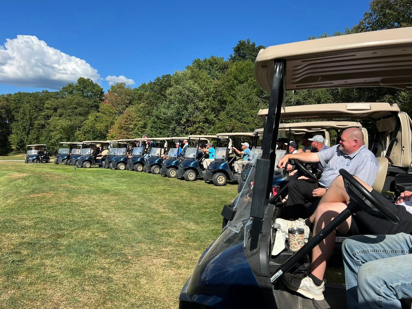 Golf members gathering to watch a golf match